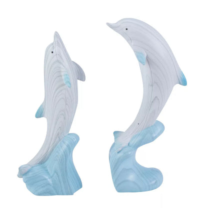 Juego de dos figurillas de delfines con base de ola